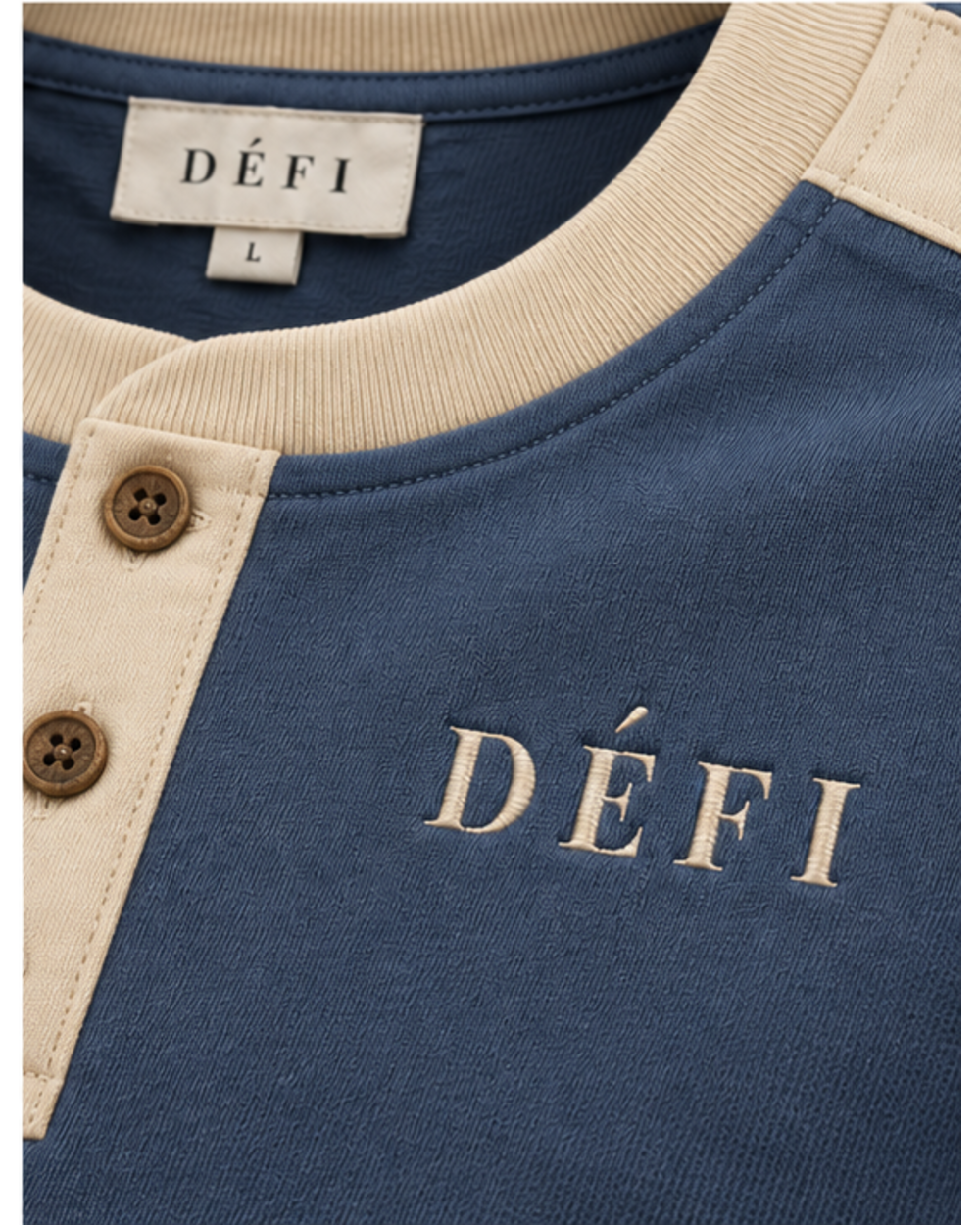 Défi Quay men's Henley T-shirt in slate blue and warm ivory, neckline and logo close-up
